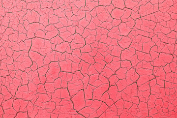 Texture of red cracked wallpaper.