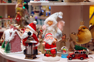 Festive toys, figurines of New Year's characters, Santa Claus, reindeer, houses. For decoration