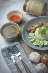 Hainanese chicken rice with fried chicken, fried chicken served with sweet dipping sauce and chicken broth, Asian style, street food commonly sold in Asia.