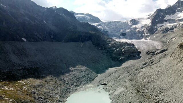 Aerial view approaching to an enormous glacier in Zinal, Switzerland
