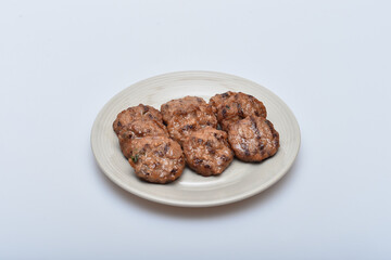 A dish of delicious-looking marinated mashed meat on a plate
