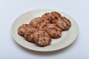 A dish of delicious-looking marinated mashed meat on a plate