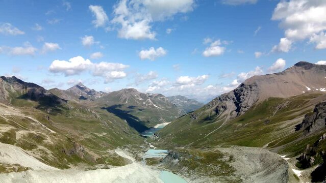 Very high aerial view of the famous Zinal valley, Switzerland, with big mountains and a blue lake