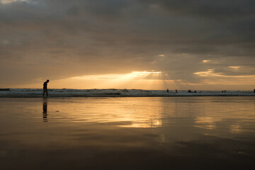 jogger at sunset on Kuta beach Bali 