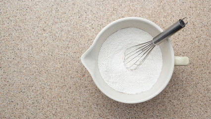 Whisked all purpose flour in mixing bowl with copy space