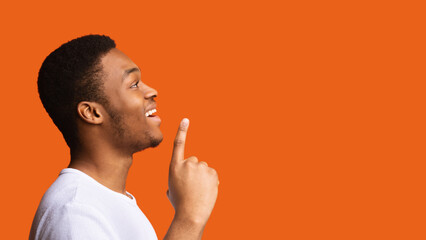 Excited Black Guy Having Idea Pointing Finger Up, Orange Background