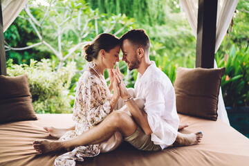 Calm male and female enjoying body and spiritual contact during daytime for teamwork therapy...