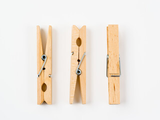 wooden spftwood pegs isolated on a white background