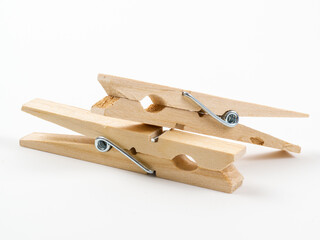 wooden clothes pegs isolated on a white background