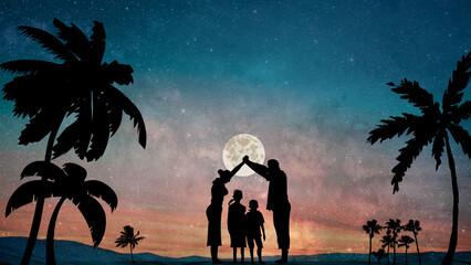 silhouette of a family on the beach