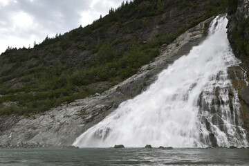 Large snow melt cascades into Mendenhall Lake.