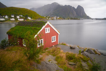 Red fishermen cabin in the fishing village of Reine in Lofoten islands, Norway