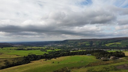 Obraz premium Aerial view of rural farmland with fields and grassland. Taken in Lancashire England. 