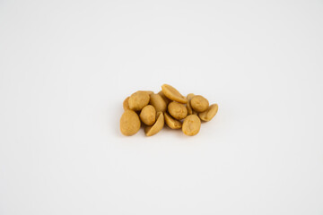 Fototapeta na wymiar Hand of peanuts on plain white background