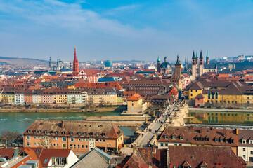 Fototapeta na wymiar Lovely panoramic view of Würzburg's famous landmarks, including the old bridge “Alte Mainbrücke”, that connects the old town with the former fishermen's quarter on the left bank of the Main river.