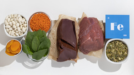 A group of healthy foods rich in iron. Healthy diet food. Cardboard sign with the inscription.