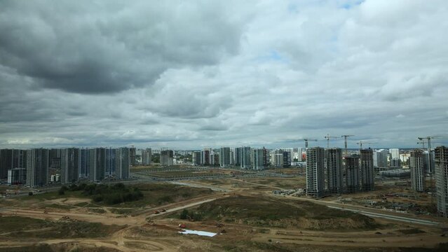Construction site of a new city block. Construction of multi-storey buildings. Panoramic photo. Aerial photography.