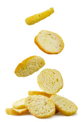 Croutons fall on a pile close-up on a white background. Isolated