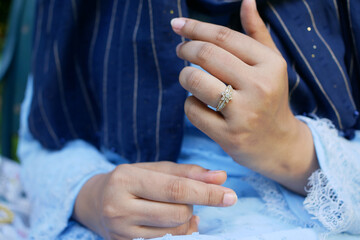 close up of women's hands with wedding ring 