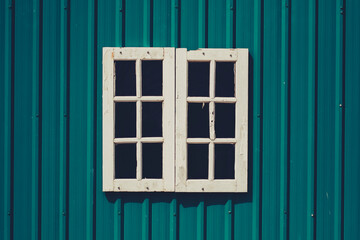 The old wooden window with shutters oin a vintage color. Vintage background -texture.