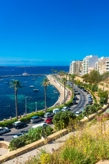 Naklejka premium Bugibba, Malta, 22 May 2022: View of the harbor and the promenade