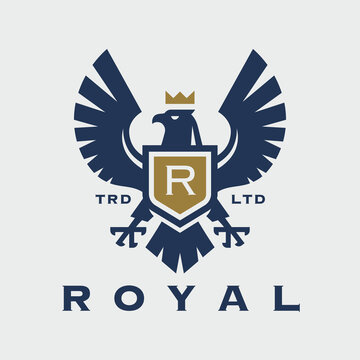 Royal eagle crest logo. Hawk shield icon. Falcon heraldry symbol. Luxury brand monogram label. Heraldic bird with crown emblem. Vector illustration.