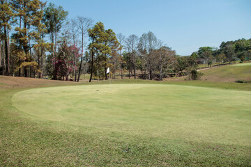 Landscape of a beautiful golf course at the sunset in the countryside.