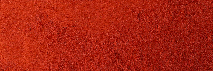 Red paprika powder background and texture