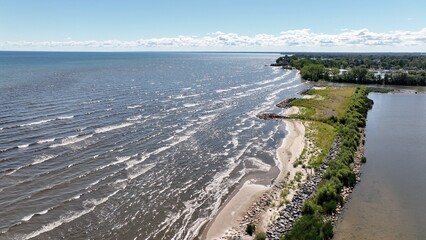 Fototapeta na wymiar Waves on Lake Ontario at Braddock Bay Wildlife preserve in Up State New York