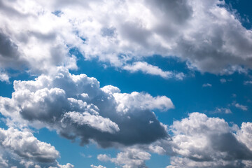 Obraz premium Soft focused view of beautiful thunderclouds. Beautiful dramatic blue sky background with fluffy clouds.