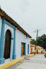 Blue facade of a house in a village in Latin America.