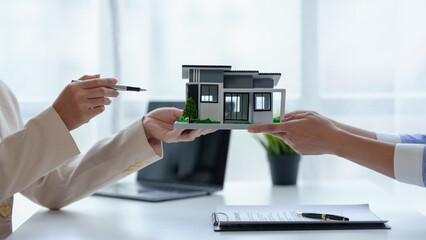 Real estate agent offer example of home sale, model home, and detail on buying home and land and selling prices, first booking deposit, and explaining mortgages and contract.