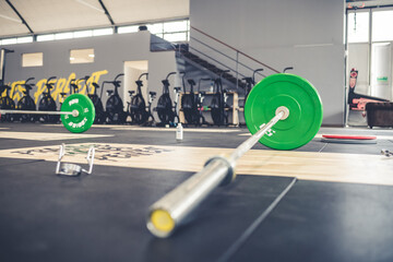 Close up barbell indoor gym with weights