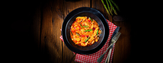 colorful turkey fricassee with asparagus and paprika