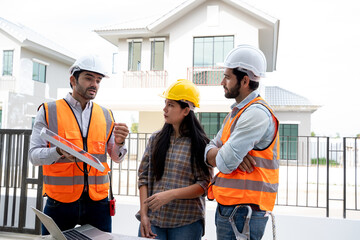 Businessmen and engineers talking and checking quality power solar cell with digital tablet on construction site.