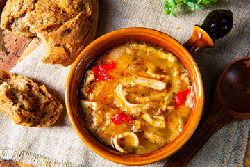 Spicy tripe soup with red paprika.