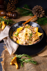 Colorful farfalle pasta with chanterelles and cream sauce.