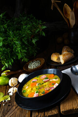 Hearty rustic pea soup with bacon and sausage