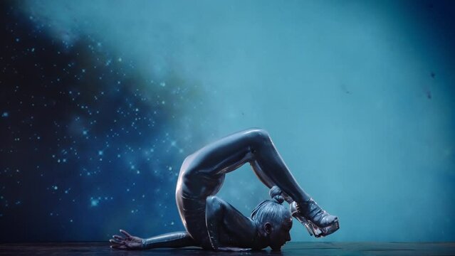 Flexible Woman Contortionist Performing on Stage Against Starry Space Back