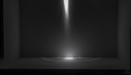 Light and shadow illuminate the black space room.