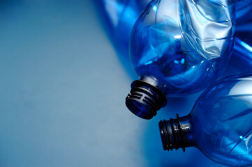 empty blue plastic bottle, recycling concept