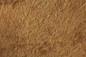 Old orange towel texture background. Pulled threads on towel. Old terry cloth texture background Household bath toweling cloth, used towel closeup texture