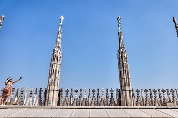 Fototapeta na wymiar Exteriors of the Duomo Cathedral in Milan Italy 