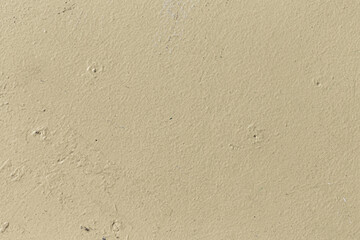 pattern of ochre painted old wall