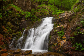 Fototapeta na wymiar Waterfall on via ferrata hikin route in Mala Fatra mountains.