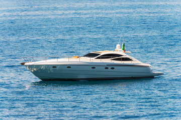 White luxury motorboat anchored in the Mediterranean Sea, Gulf of La Spezia, Liguria, Italy, southern Europe.