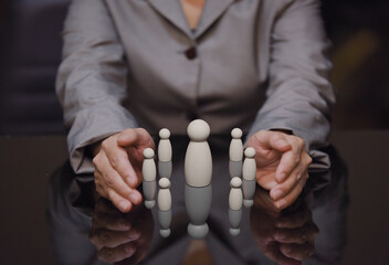 business woman holding wooden human team, working connection and team work coordination in...