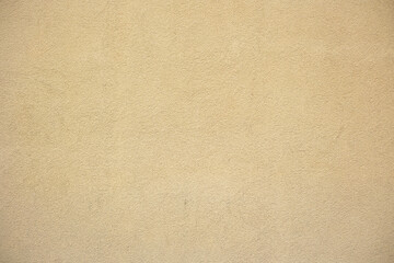 Plastered wall. Textured beige background.