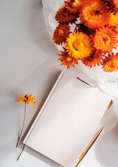 Styled notebook or journal flat lay with copy space, fall theme