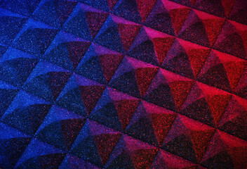 Pyramid sound isolation foam texture in a purple, artistic aesthetic. Material used in construction for sound proofing music recording, studios